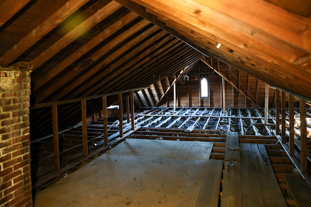 older attic, lots of rafters and dark wood